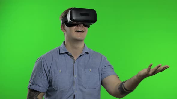 Man Using VR Headset Helmet To Play Game. Watching Virtual Reality 3d 360 Video. Chroma Key alt