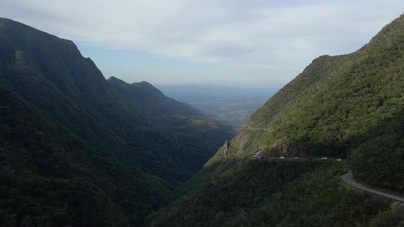 Serpantine Road in Mountain Gorge with Green Forest alt