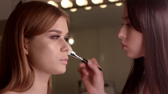 Make-Up Artist Applies Make-Up on Face