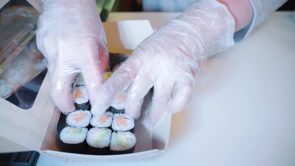 Fresh sushi prepared for takeout in an Asian Restaurant alt
