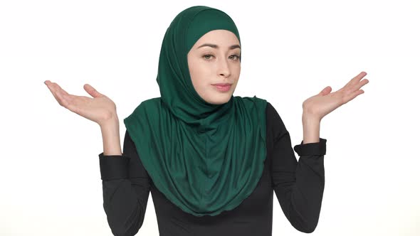 Portrait of Pretty Woman in Religious Niqab Throwing Up Hands Meaning Have No Idea or Not My alt