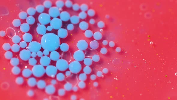 Bright Collors Bubbles Slow Motion Oil Ink. Pink and blue Bubblegum flavor background. alt