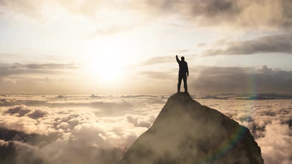 Magical Fantasy Adventure Composite of Man Hiking on Top of a Rocky Mountain alt