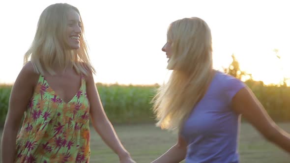 Girlfriends walking and laughing together outdoors