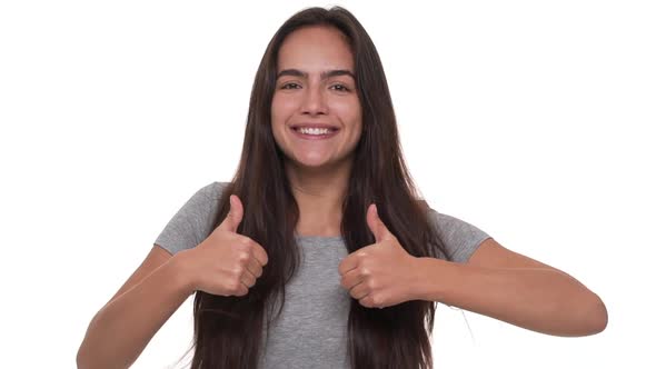 Slow Motion Portrait of Funny Woman Suddenly Appearing From Bottom on Camera Showing Thumbs Up with alt