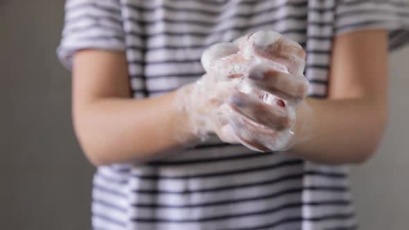 COVID Coronavirus Washing Hands With Liquid Soap Under Running Water On Home Sink. alt