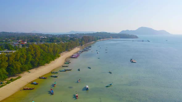 A sailboat in blue turquoise seawater near Phuket island in summer season during travel holidays alt