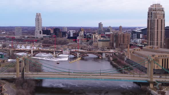 Hennepin Avenue Bridge and Third Avenue Bridge in construction on Mississippi River, Minneapolis Min alt