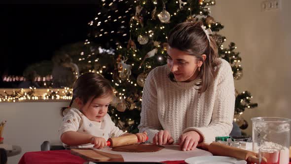 Mother and Daughter Making Gingerbread at Home alt
