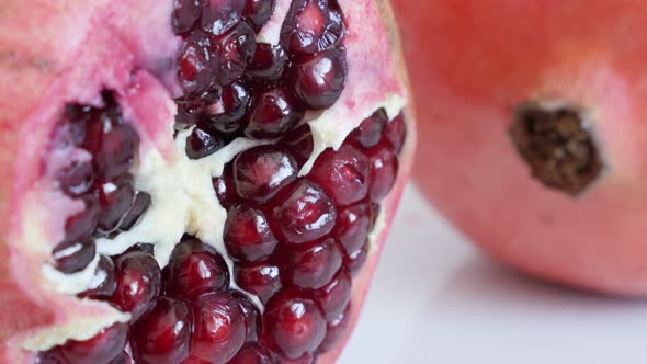 Close-up of red healthy Punica granatum 4K 3840X2160 UHD tilting   video - Raw seeds inside Lythrace alt