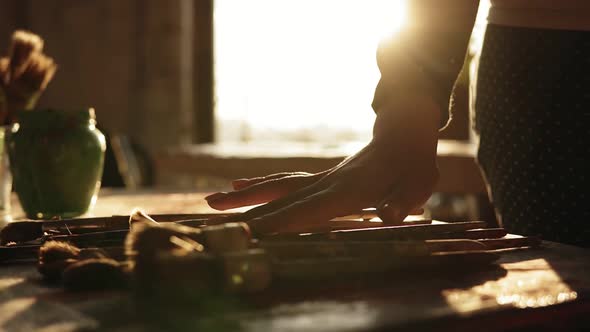 Close Up Footage of Accurately Manicured Female Hand Hesitating to Choose Brush From a Row on the alt
