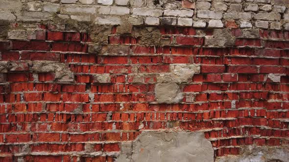 Remains of a Wall of Old and Broken Red Bricks