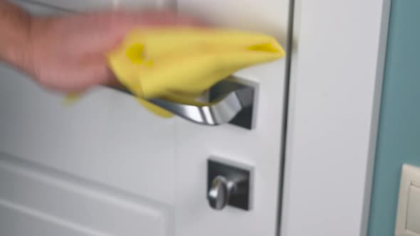 Sanitizer Disinfection of Handle on Door in Room