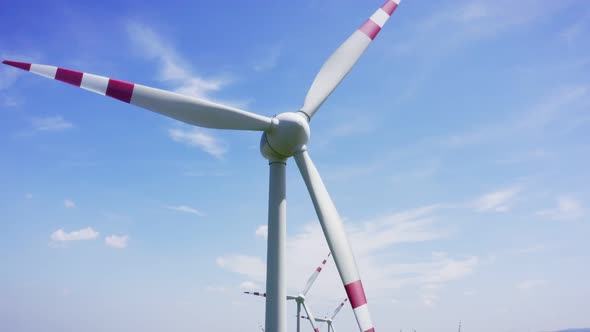 Clear renewable energy production. Farm landscape, Aerial flight near wind turbines