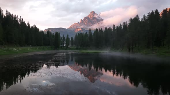 Mountain lake in the Dolomites with Tre Cime di Lavaredo reflection alt