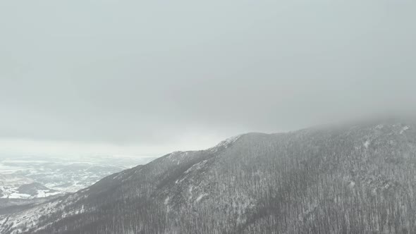 Snowing on top of the mountain Veliki Krsh 4K aerial video alt