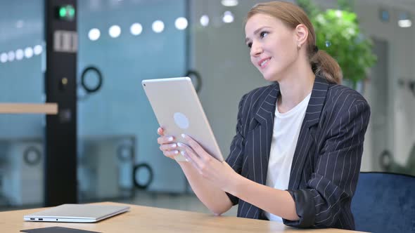 Professional Businesswoman Doing Video Call on Tablet  alt