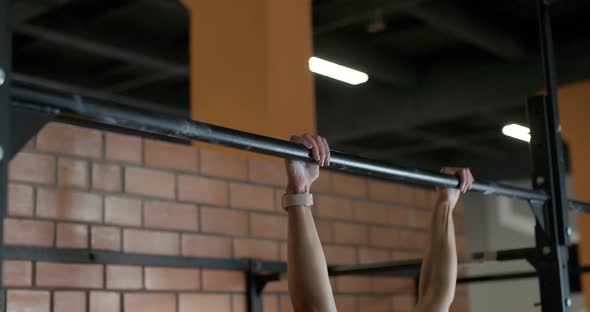 Young Woman Performs Pull-ups on the Horizontal Bar, Crossfit Training Day in the Gym, Strength Body alt