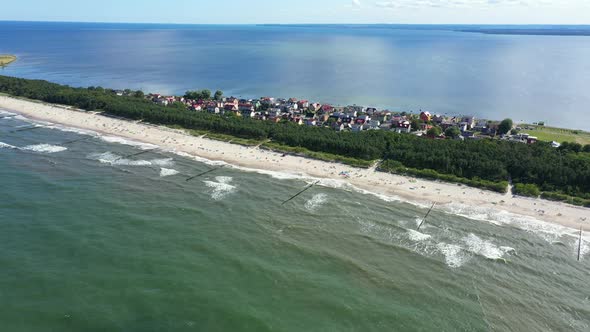 Beach in beautiful city Chalupy resort in Poland. Aerial video. Baltic Sea.Waves coming in. alt
