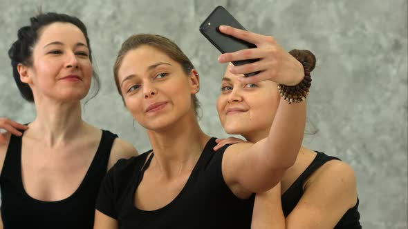 Three Young Women Making Selfie After Workout at Yoga Class alt