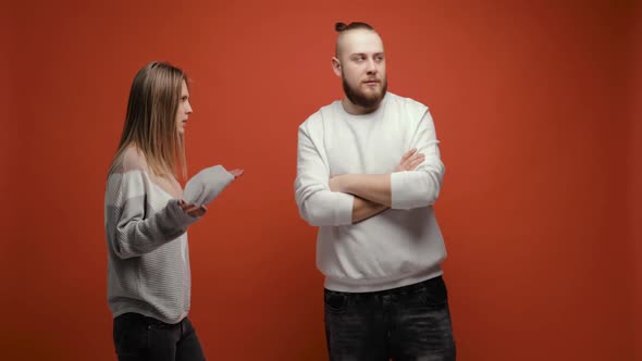 Angry Young Bearded Brunet Man Leaves His Girlfriend Who Yelling on Him