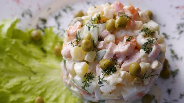 Russian Salad Olivier on a White Plate