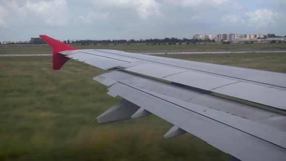 The Plane Travels on the Ground. View From the Airplane Window To the Wing. alt