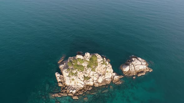 Small Boat and Small island in Sea alt