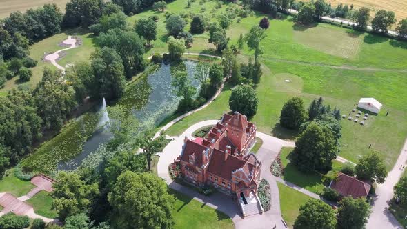 Jaunmoku Brick Medieval Castle Near Tukums, Latvia  Aerial Dron 4k Shot Jaunmokas Manor Park. alt