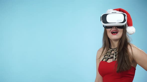 Christmas Girl in Virtual Reality Goggles  alt