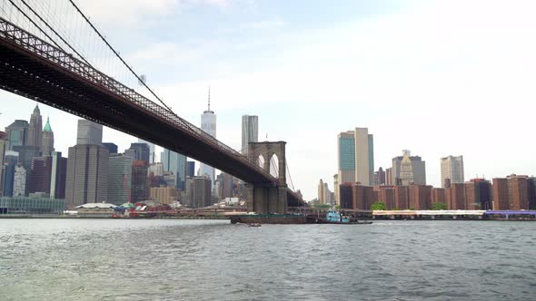 Tugboat Under Brooklyn Bridge