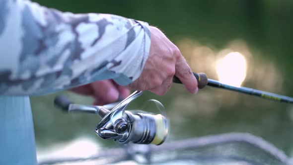 Handle Rotation with Reel of Fishing Rod Close Up