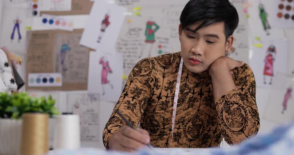 Fashion designer man draws a sketch clothing alt