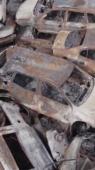 Vertical Video of a Dump of Destroyed Cars During the War in Ukraine alt