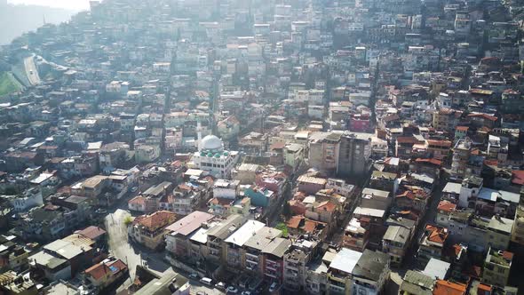 Drone view on poverty slum district and muslim mosque alt