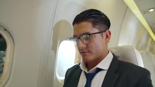 Businessman Travel on a Business Trip By Airplane alt