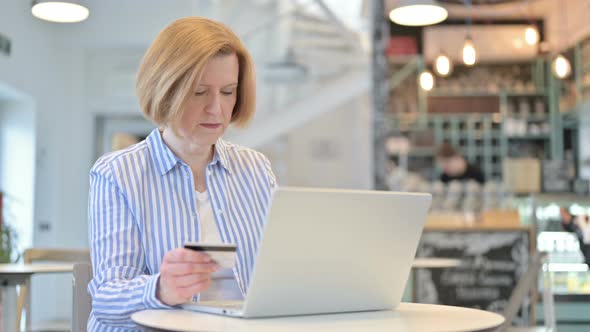 Unsuccessful Online Payment on Laptop By Creative Old Woman  alt
