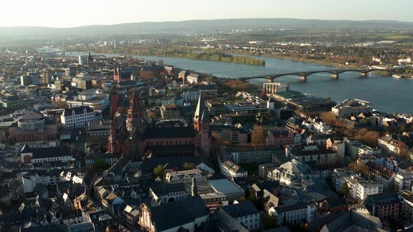 Slow drone shot around Mainz the red Cathedral church in the middle of the old town with the Rhine r alt