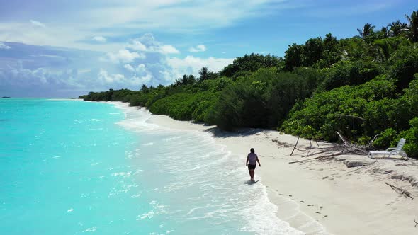 Pretty smiling lady relaxing having fun on the beach on sunny blue and white sand background 4K alt