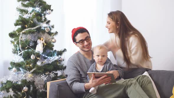 Happy Family Buying on the Internet for Christmas Gifts