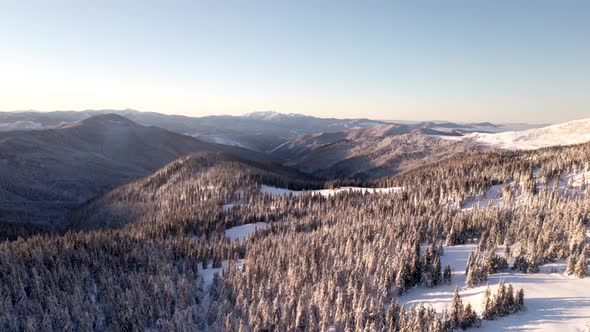 Aerial Slider Shot of Mountain Forest Valley at Sunrise
