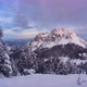 Winter Sunrise Over Snowy Mountains Clouds Spill Over the Mountain Windy Weather - VideoHive Item for Sale