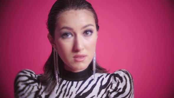 Sexy Young Fashion Model Asian Woman is Standing in a Zebra Striped Dress in the Studio alt