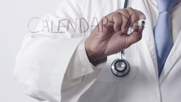 Asian Doctor Writing Calendar Year