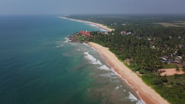 Travel to tropical resort. Luxurious hotel with a swimming pool on a rocky ocean shore. Paradise vac alt