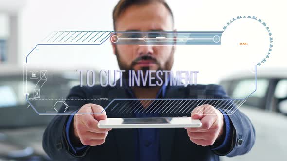 Businessman Holds a Tablet with HUD Futuristic Elements. Hologram with an Inscription - To Cut