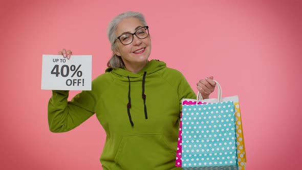 Senior Granny Woman Showing Shopping Bags and Up To 40 Percent Off Inscriptions Banner Black Friday alt