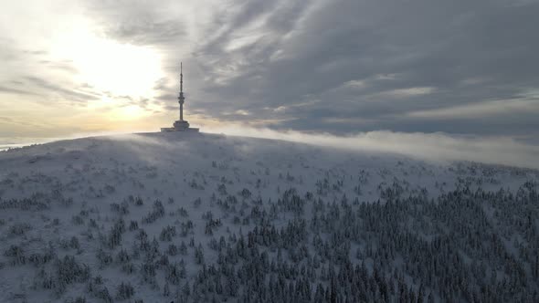 Drone view sunrise in Praděd, Czech republic. Mast tower on winter. alt