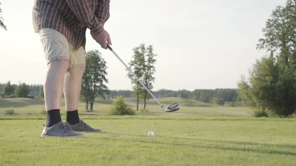 Unrecognized Man Playing Golf Hitting Golf Ball on the Golf Course alt