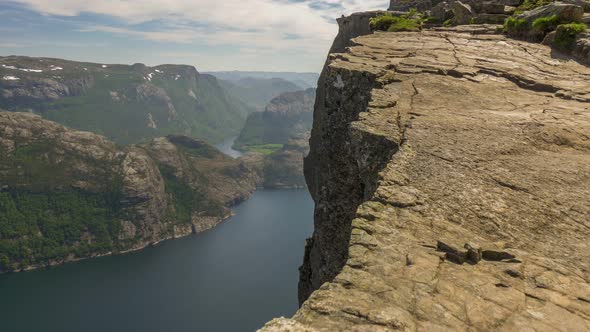 Camera Moves Along the Edge of the Cliff. Mountains and Fjord Seen at Background. Preacher Chair alt